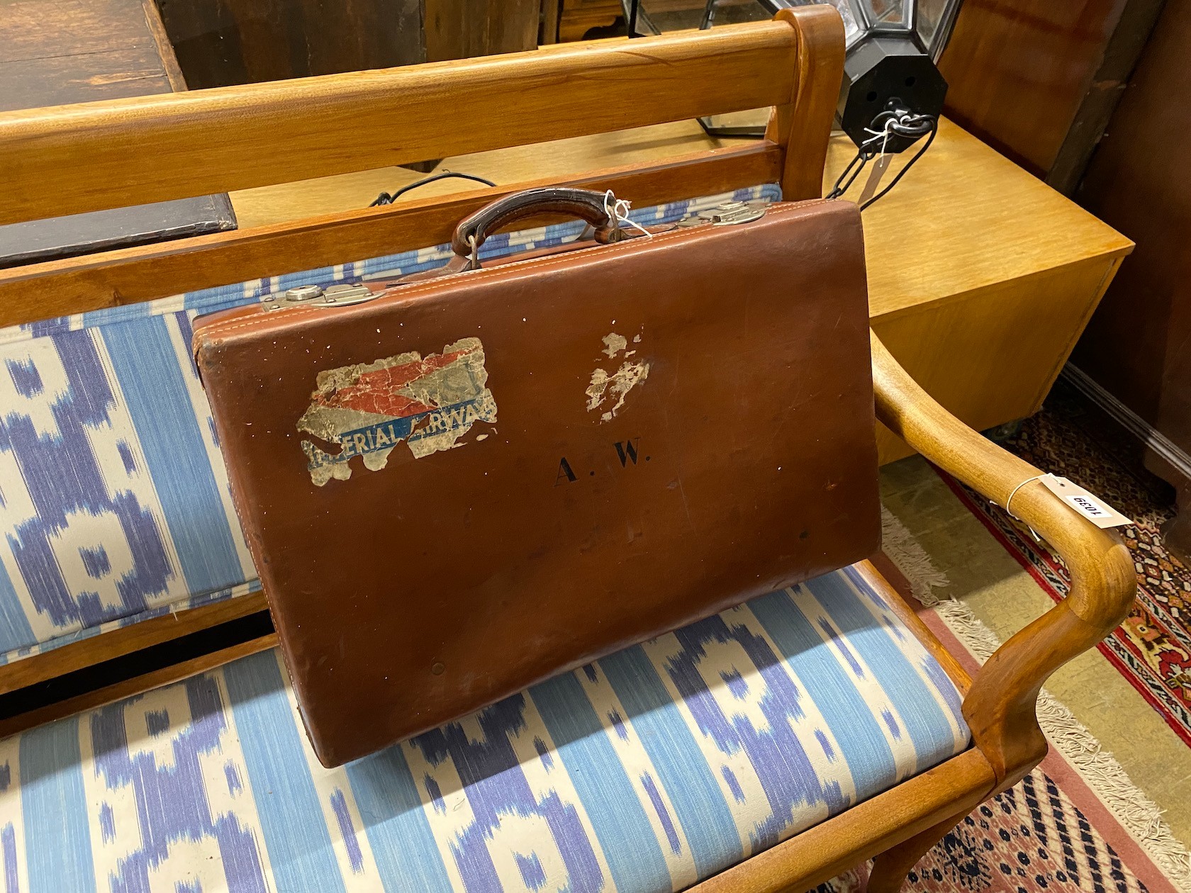 Four vintage suitcases, largest 82 x 53cm